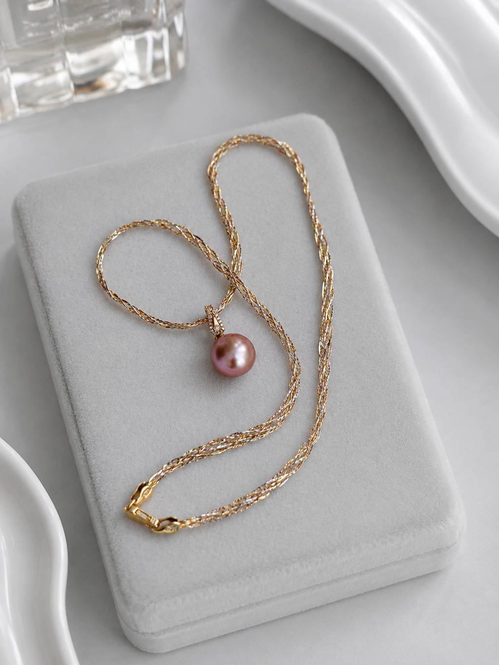 Gold detachable pearl pendant set with layered chain and purple pearl drop