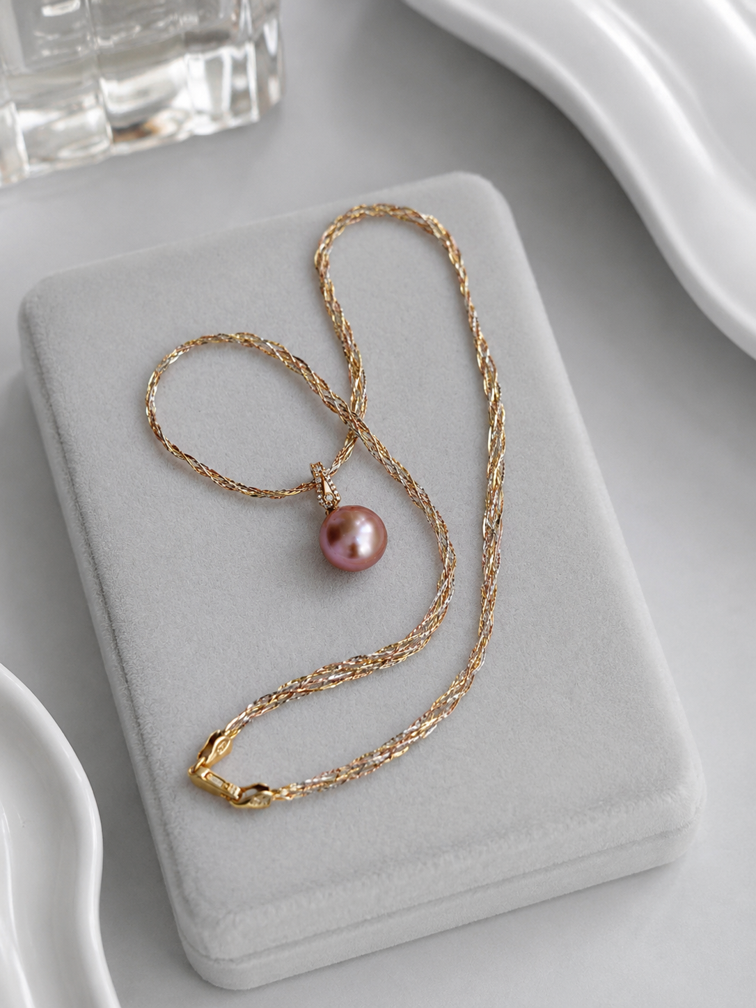 Gold detachable pearl pendant set with layered chain and purple pearl drop