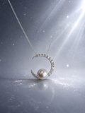Silver crescent pendant with round pearl centerpiece and pavé stones on chain