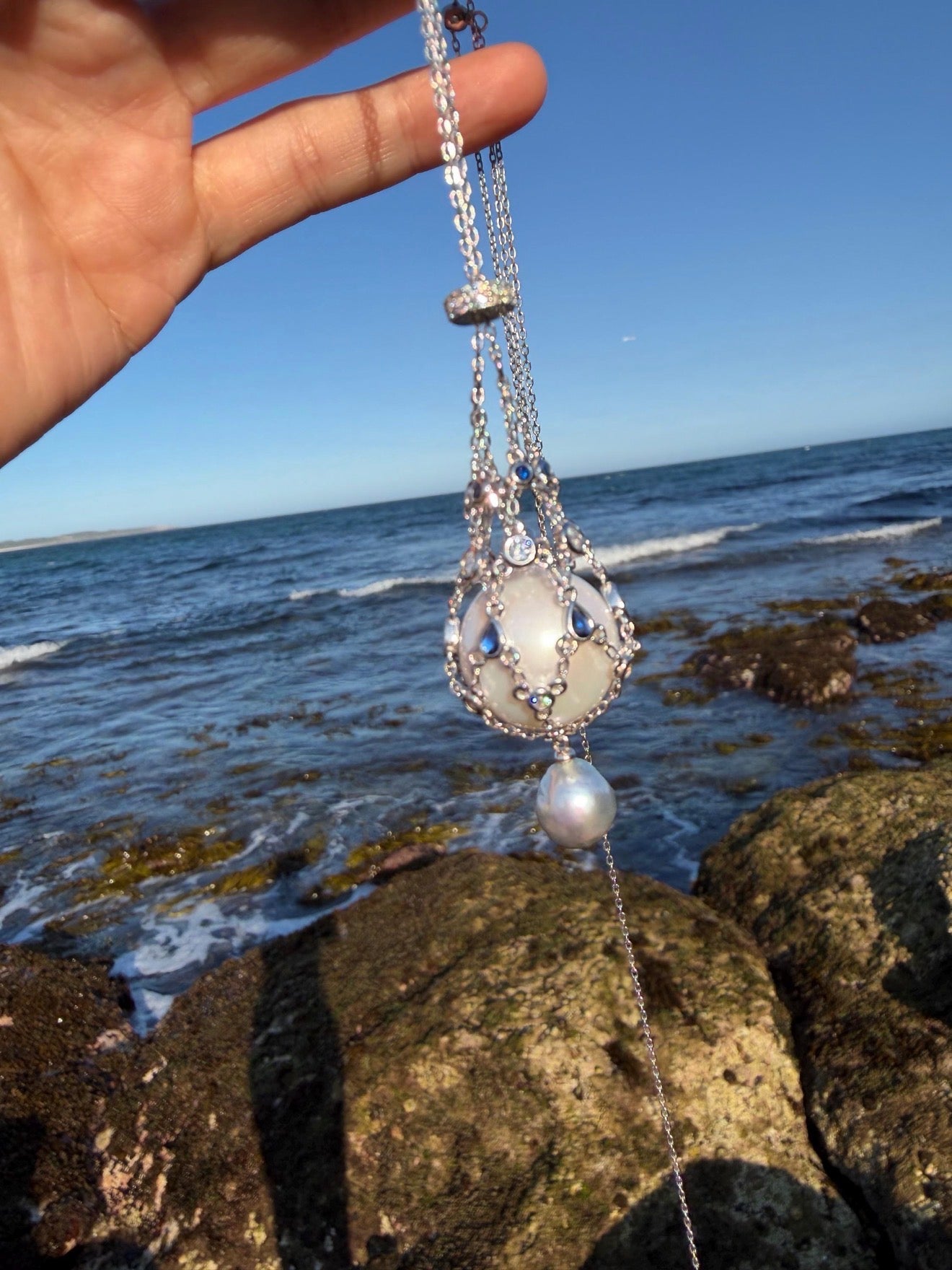 Silver tone teardrop openwork pendant necklace with blue stones and pearl