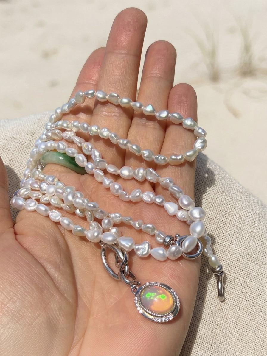 Multiple strands of keshi pearl necklaces with silver-toned toggle clasps and charm