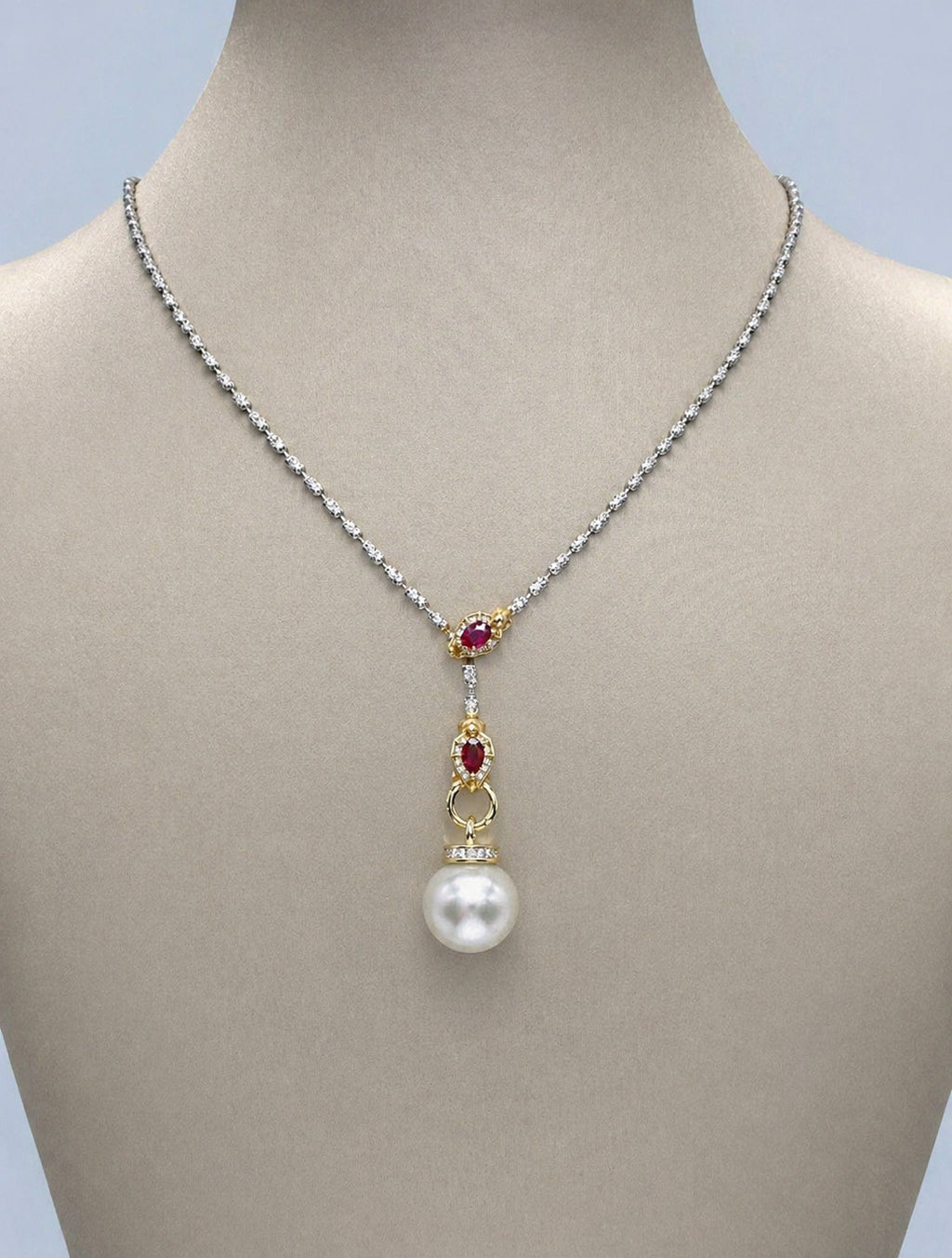 Silver-tone South Sea pearl pendant with red stone detail and small clasp