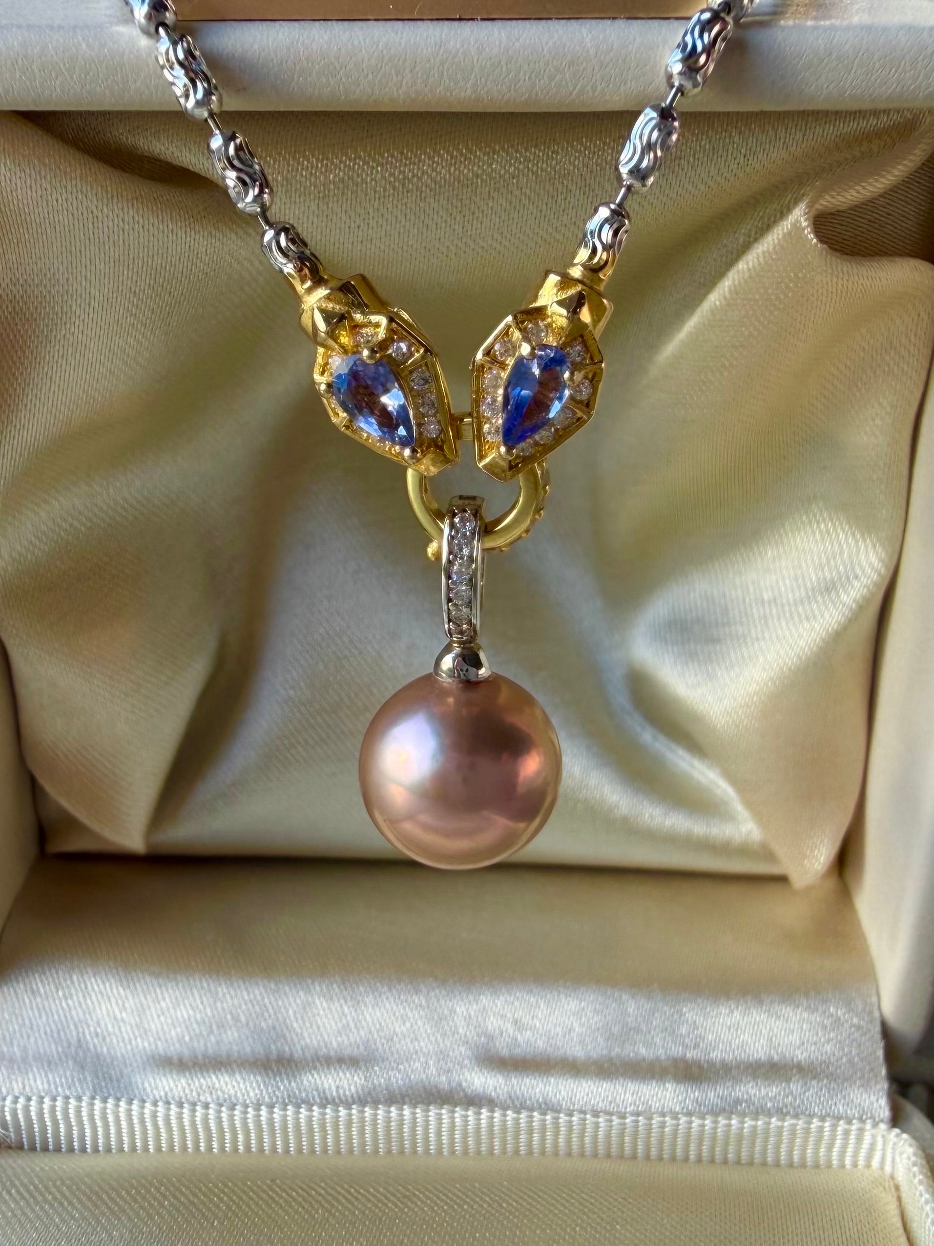 Rainbow tourmaline necklace featuring blue teardrop charms and rose-pink pearl