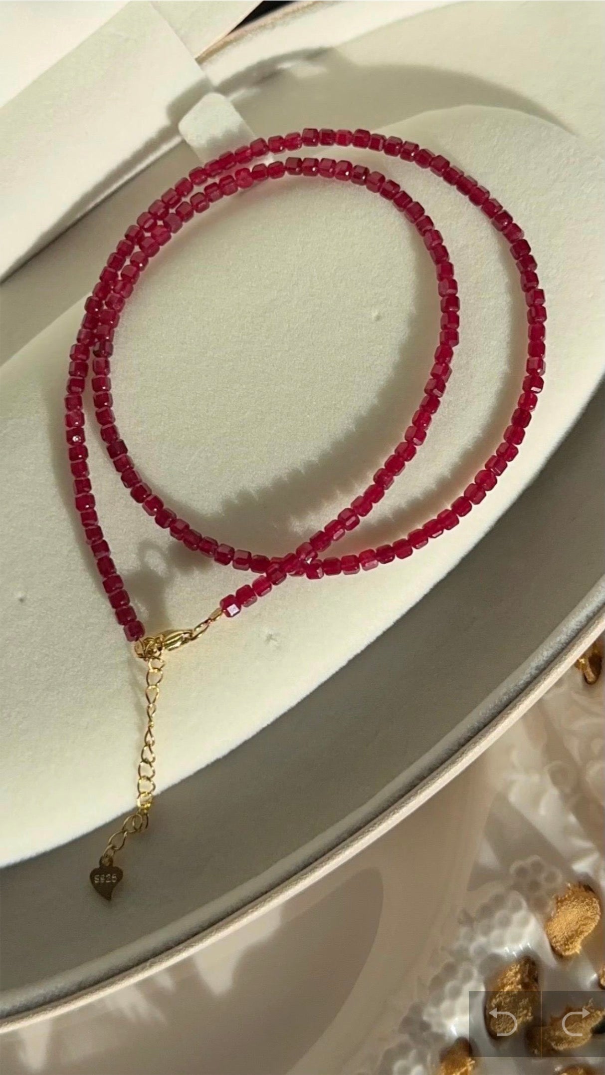 Ruby bead necklace with clasp, double strands and small heart-shaped extender charm