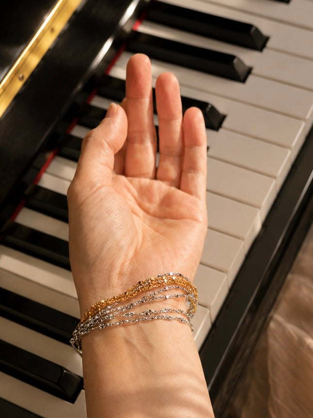 Sparkly gold and silver beaded extender chain bracelet on wrist