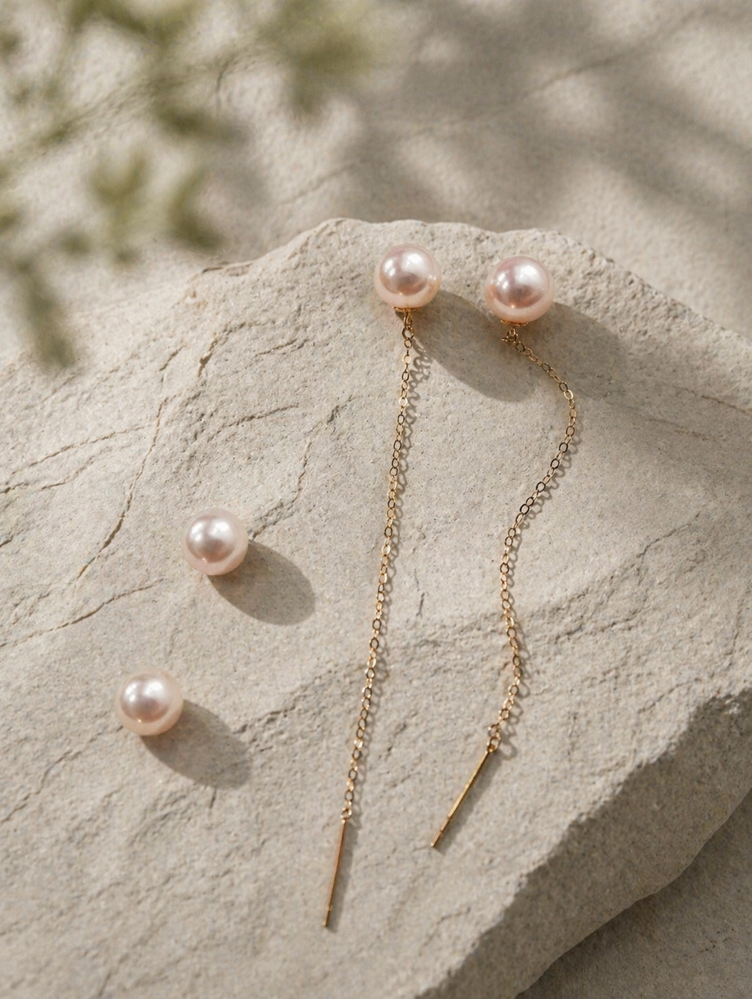 Long threader pearl earrings with gold-tone bars and three dangling pearls