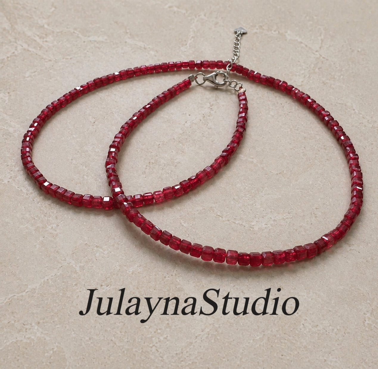 Ruby square-cut bead necklace with silver clasp and extension chain, layered strands