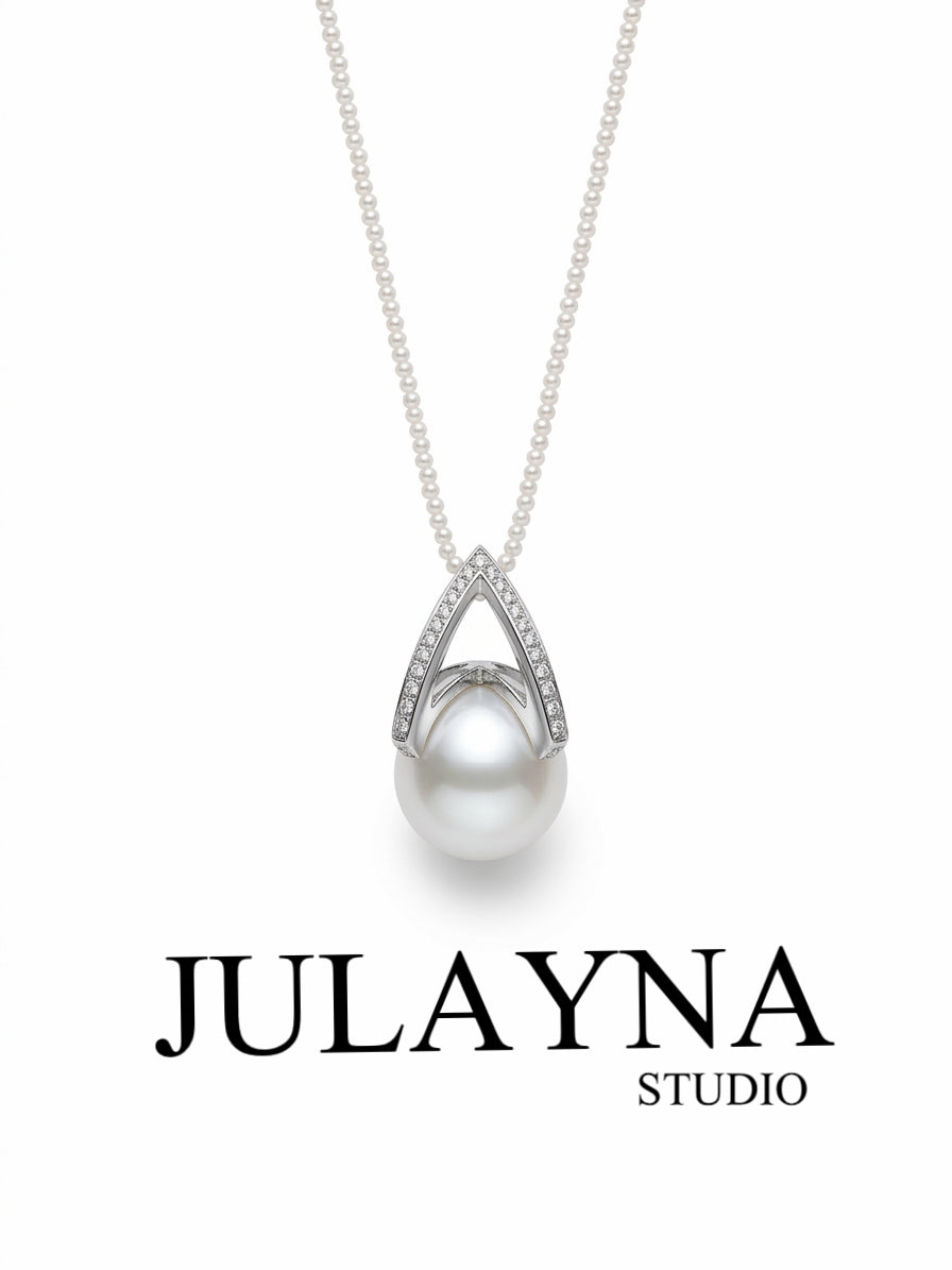 Pear-shaped freshwater pearl pendant with white pearl and diamond-style halo on chain