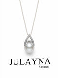Pear-shaped freshwater pearl pendant with white pearl and diamond-style halo on chain