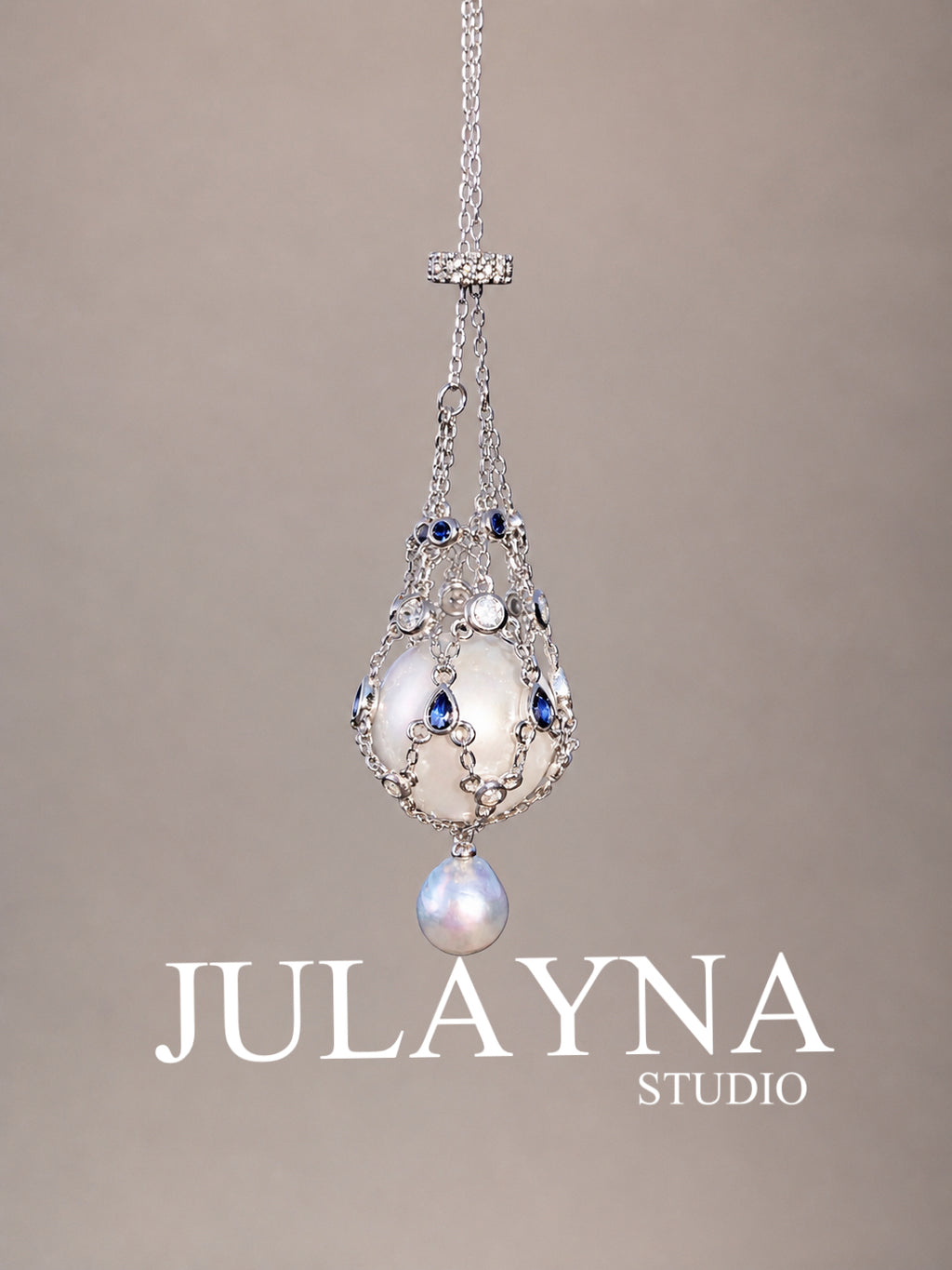 Silver tone openwork teardrop pendant necklace with blue stones and pearl drop