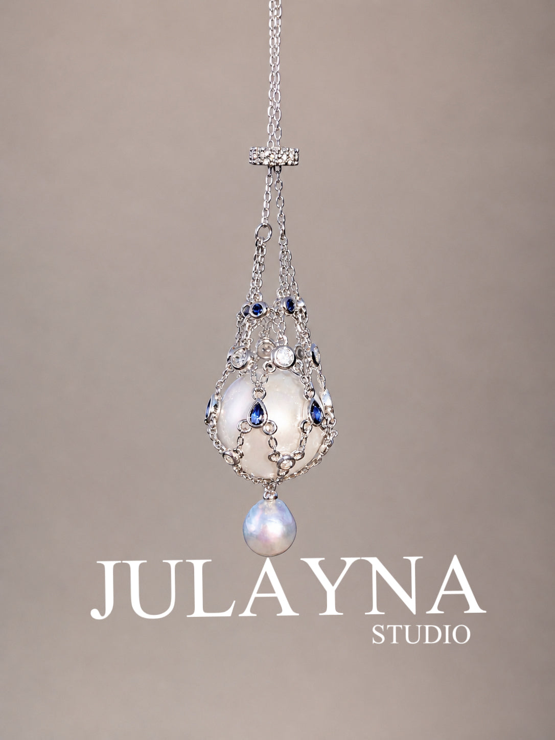 Silver tone openwork teardrop pendant necklace with blue stones and pearl drop