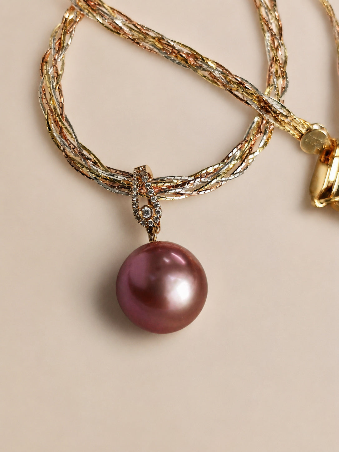 18K gold pearl pendant with diamond bail and purple pearl on layered chain