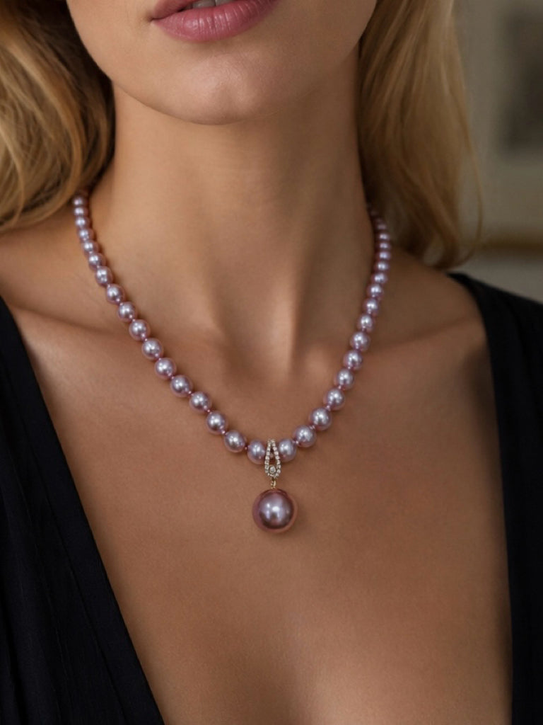 Purple pearl necklace with diamond clasp and dangling round pearl pendant