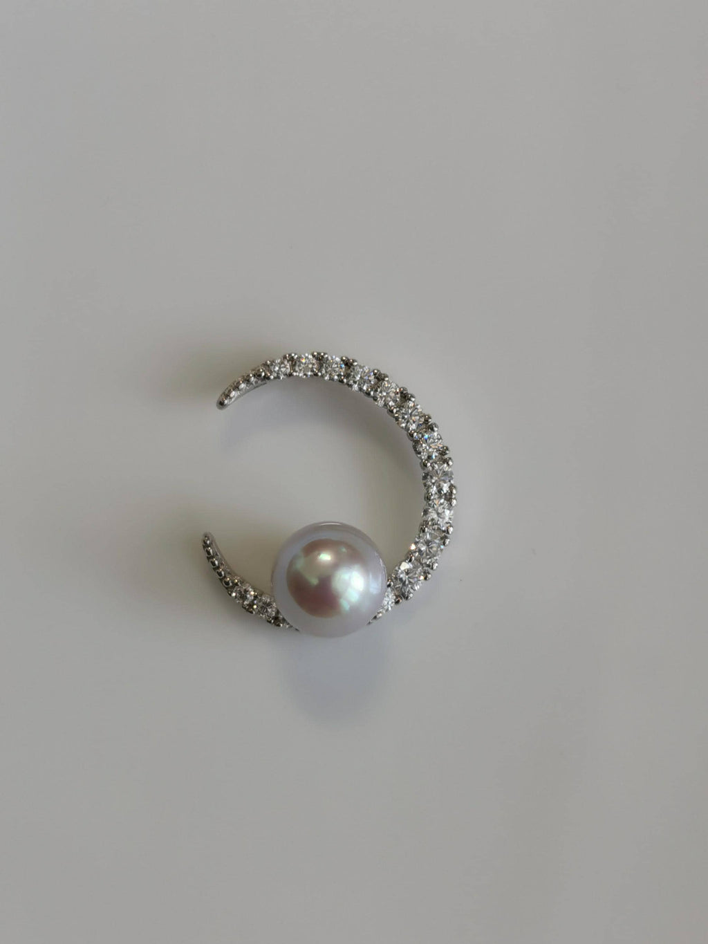 Silver crescent pearl pendant with pavé stones and round cultured pearl centerpiece