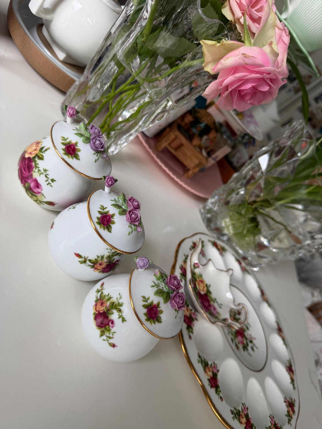Porcelain sugar and salt jars with rose floral designs and gold trim, assorted angles