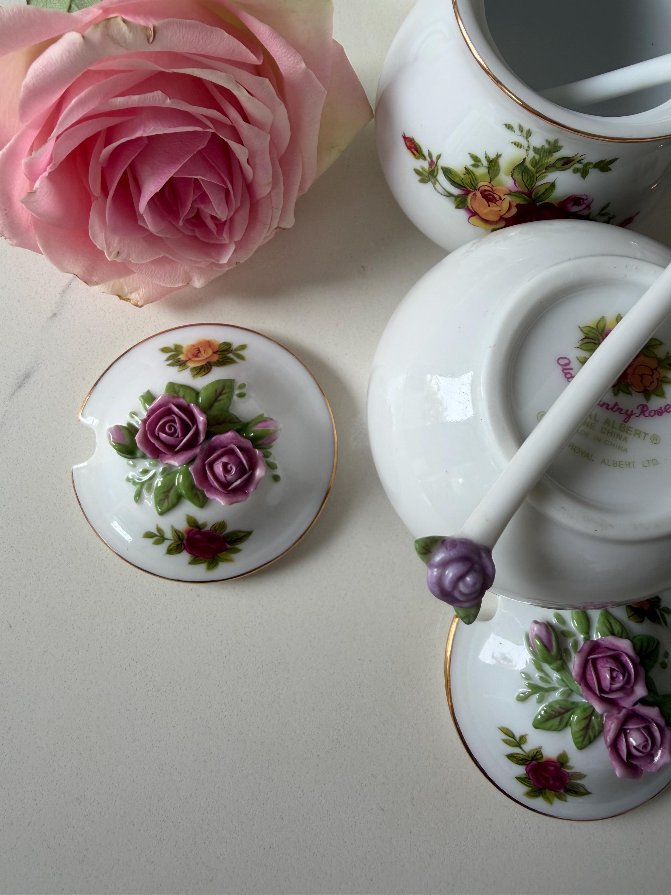 Porcelain sugar and salt jar set with rose floral prints and purple-topped lids